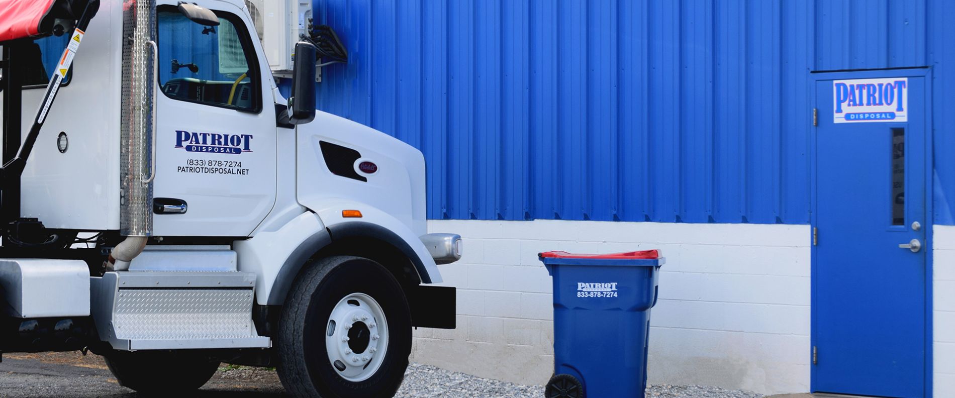 Patriot Disposal Truck and building